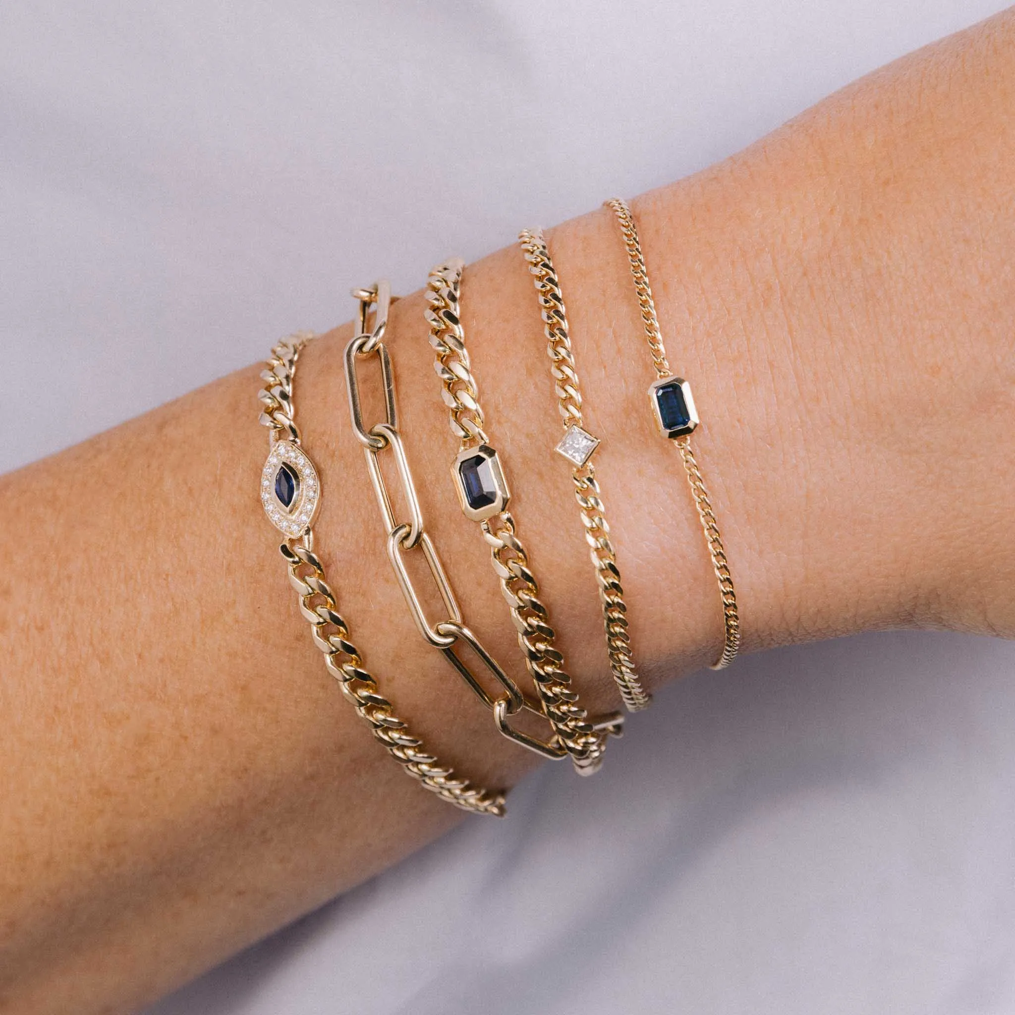 14k Medium Curb Chain Emerald Cut Blue Sapphire Bezel Bracelet