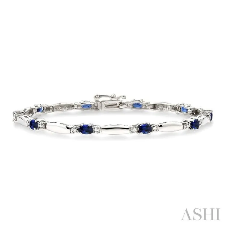 5x3 MM Oval Cut Sapphire and 1/10 ctw Bar and Oval Mount Round Cut Diamond Precious Bracelet in 10K White Gold