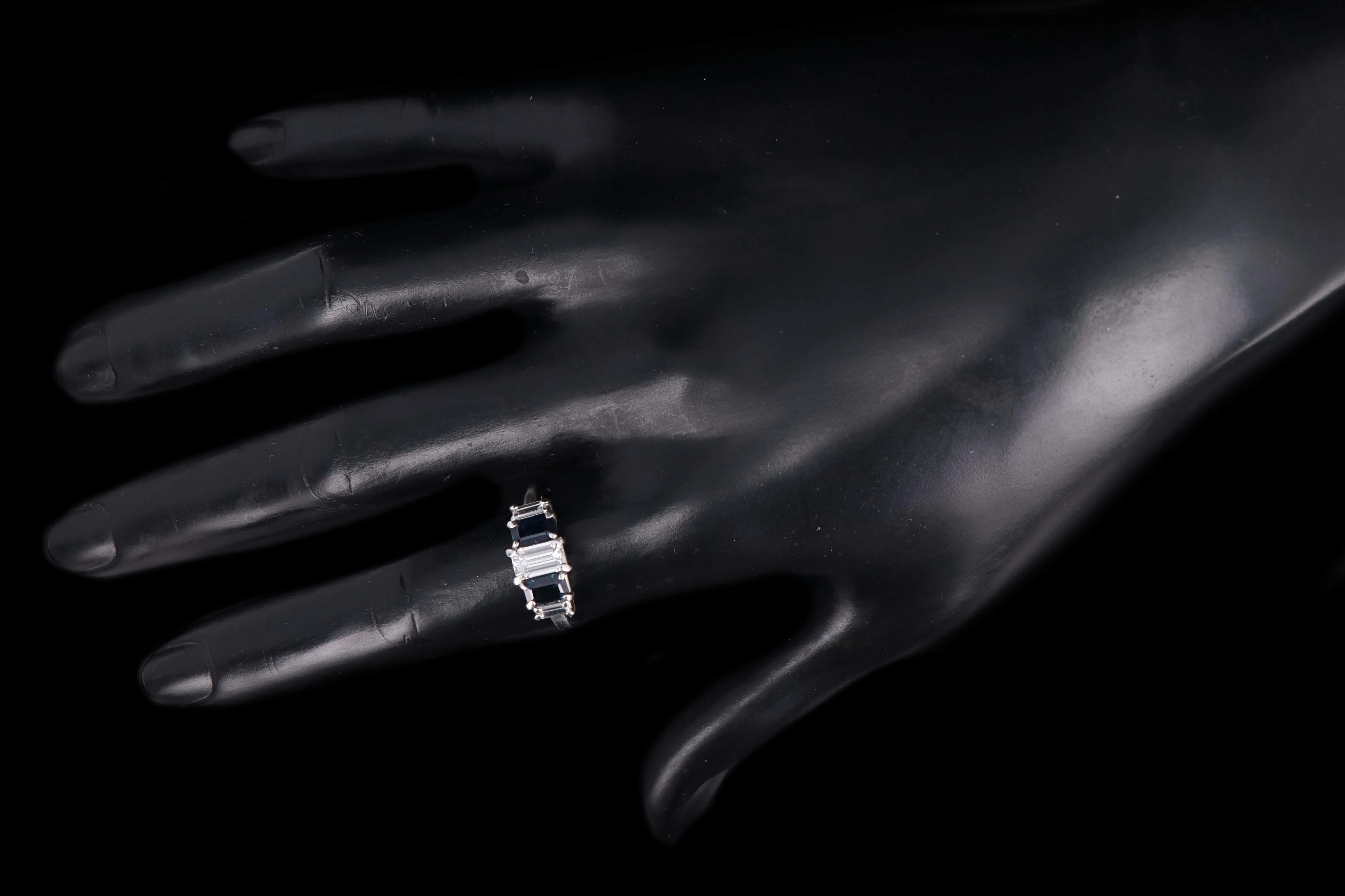 Modern Platinum .70 CTR Emerald Cut Diamond and Sapphire Ring