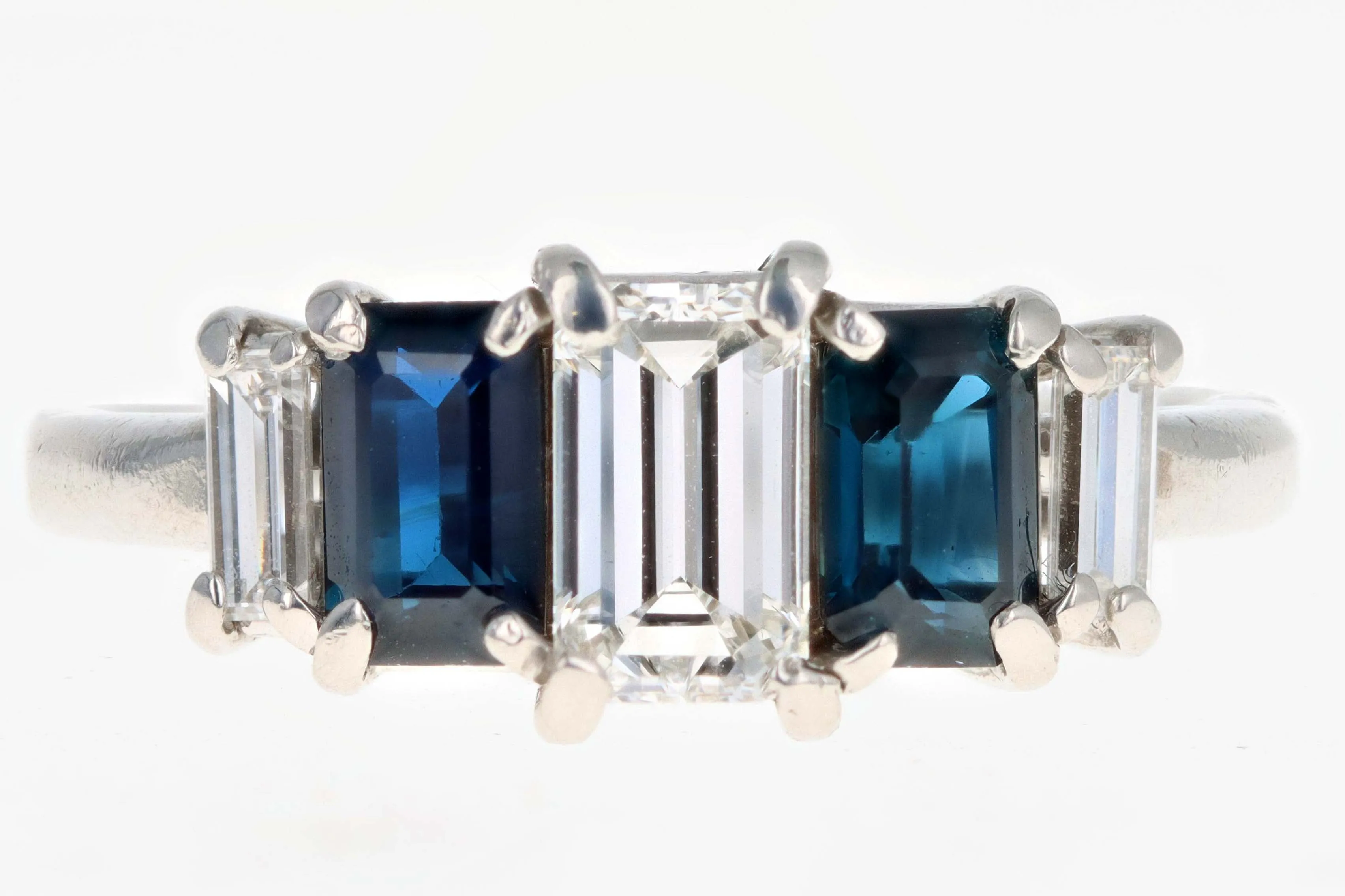 Modern Platinum .70 CTR Emerald Cut Diamond and Sapphire Ring