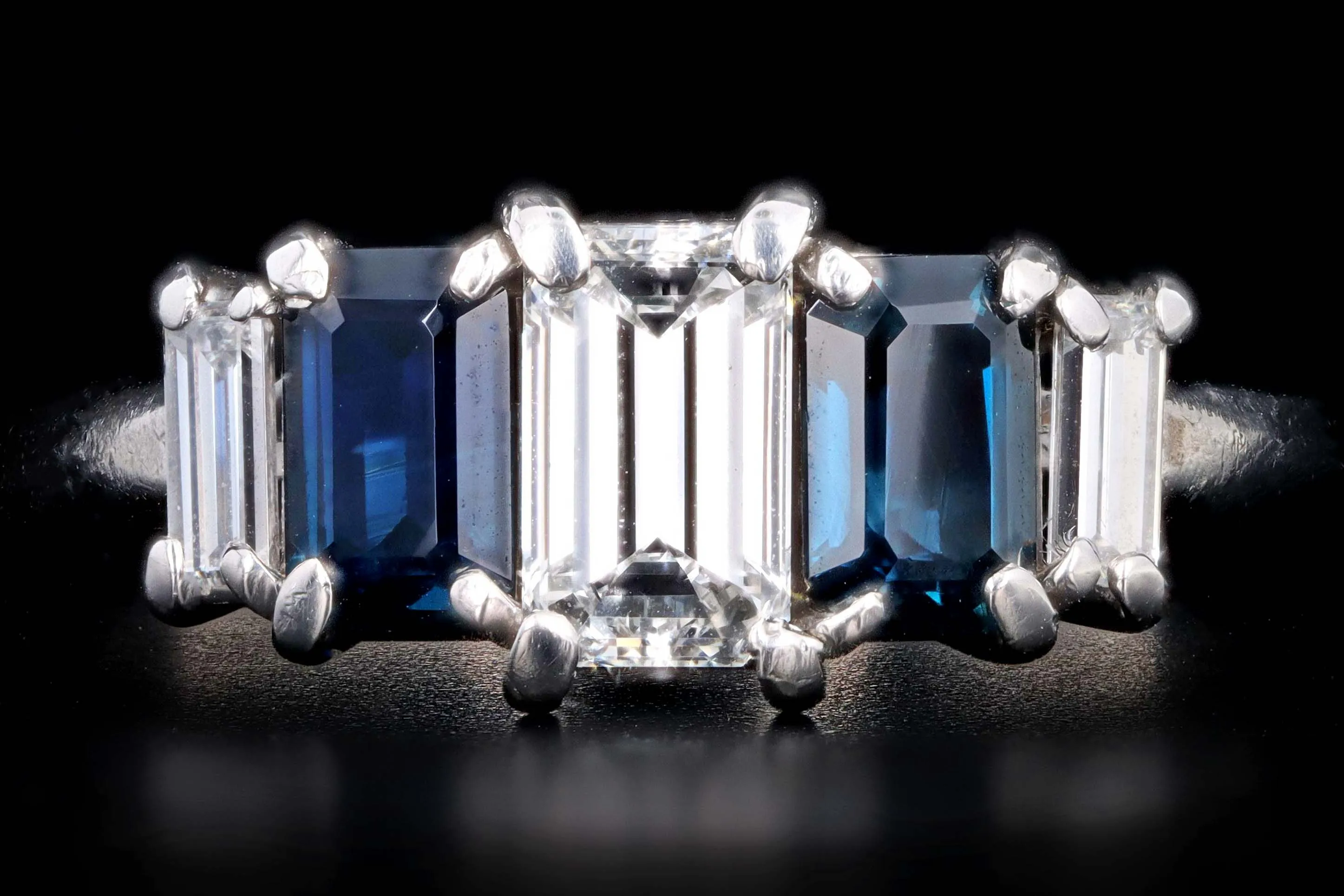Modern Platinum .70 CTR Emerald Cut Diamond and Sapphire Ring
