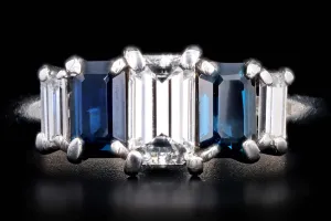 Modern Platinum .70 CTR Emerald Cut Diamond and Sapphire Ring