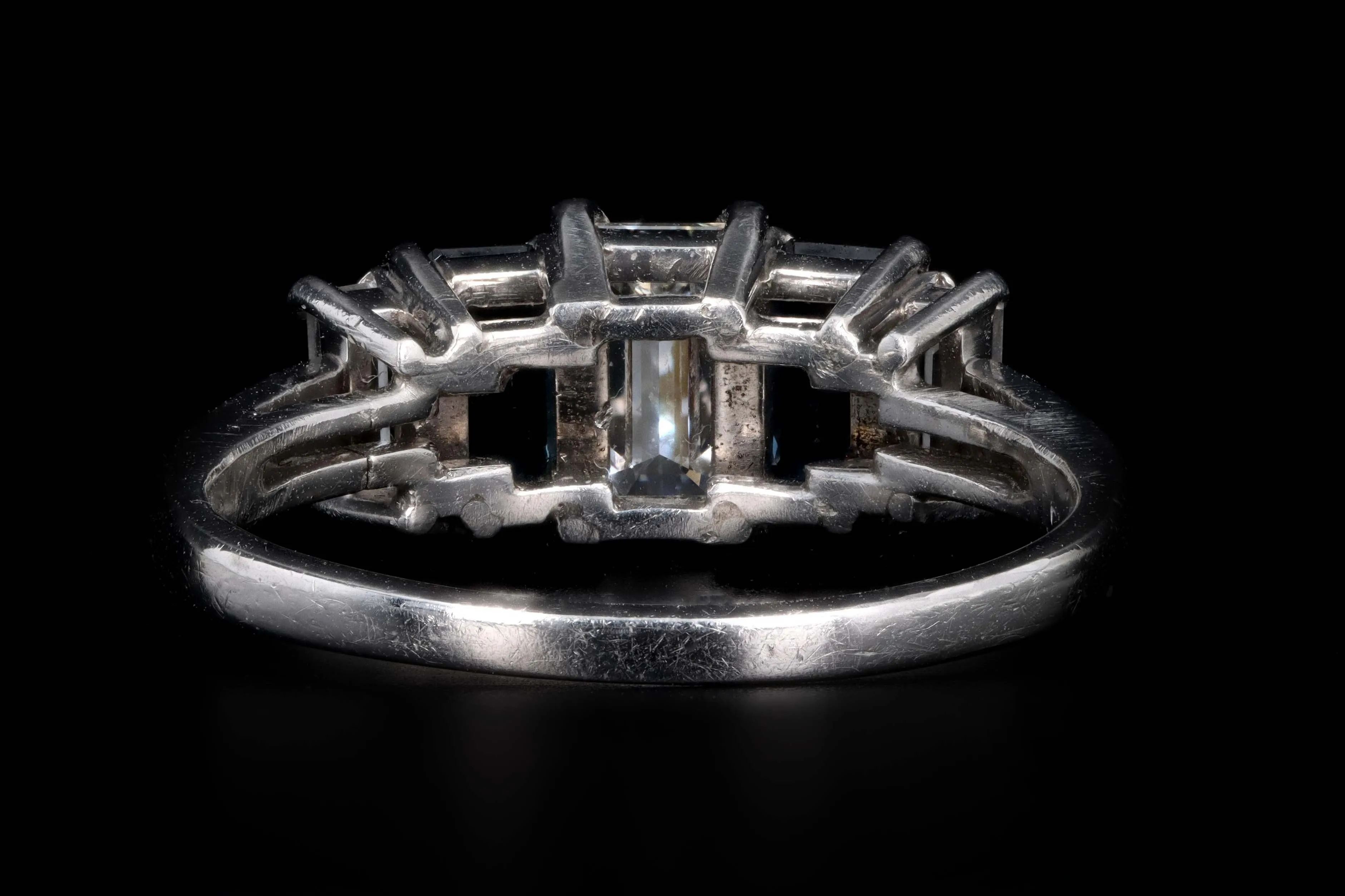 Modern Platinum .70 CTR Emerald Cut Diamond and Sapphire Ring