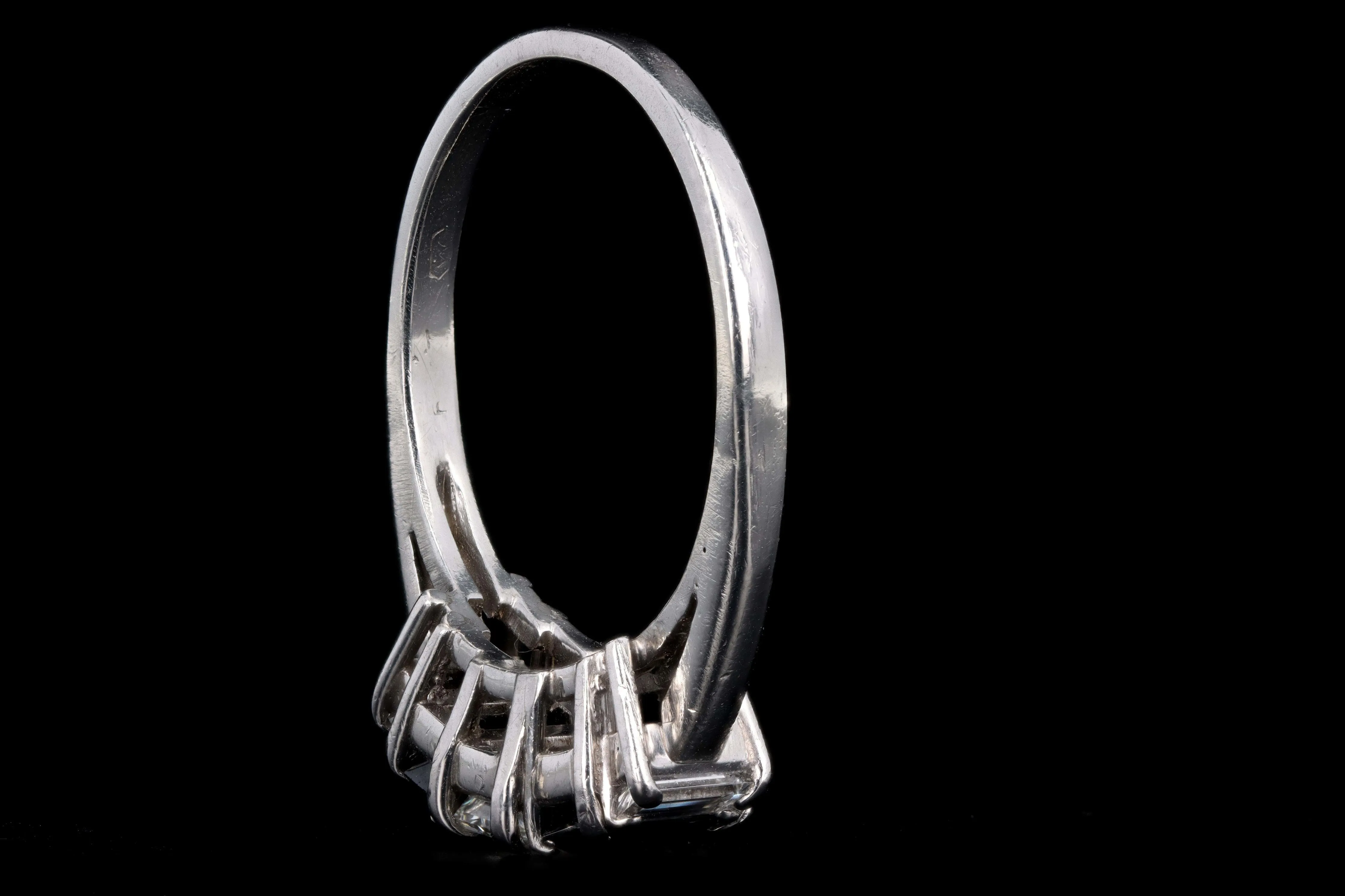 Modern Platinum .70 CTR Emerald Cut Diamond and Sapphire Ring