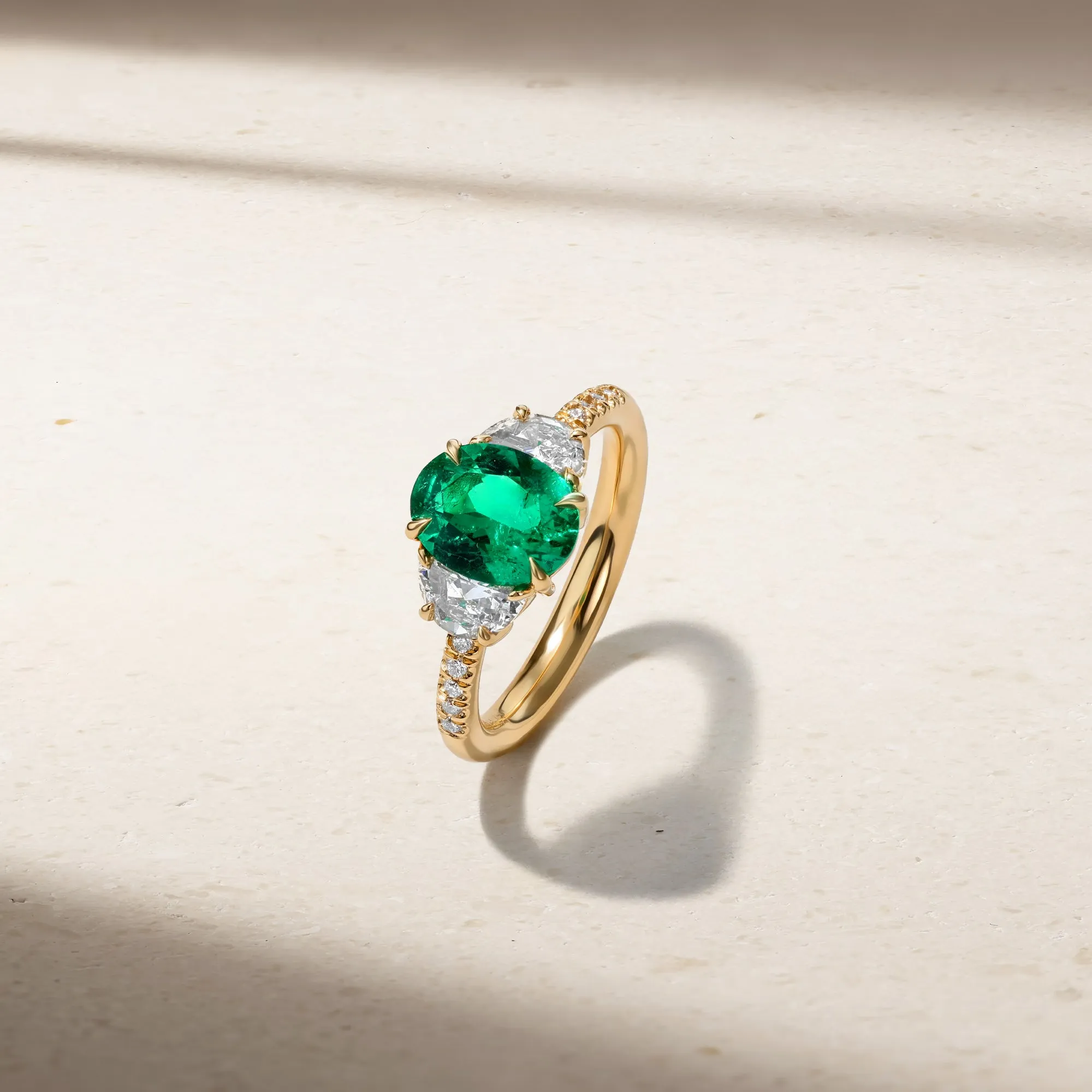 Nouveau Three Stone Oval Emerald and Diamond Ring