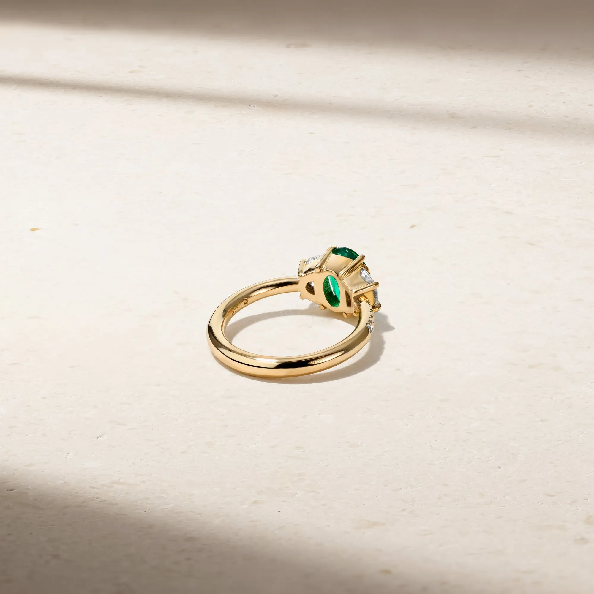 Nouveau Three Stone Oval Emerald and Diamond Ring