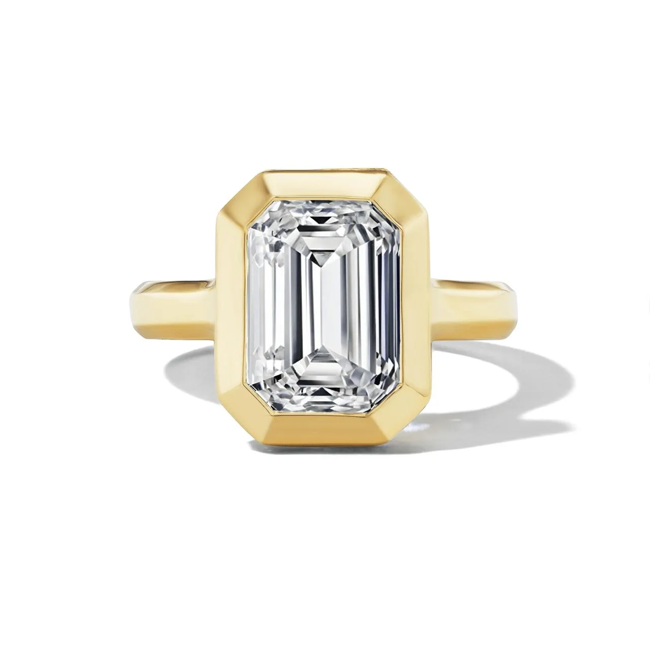 SHIELD BEZEL SET EMERALD CUT DIAMOND ENGAGEMENT RING