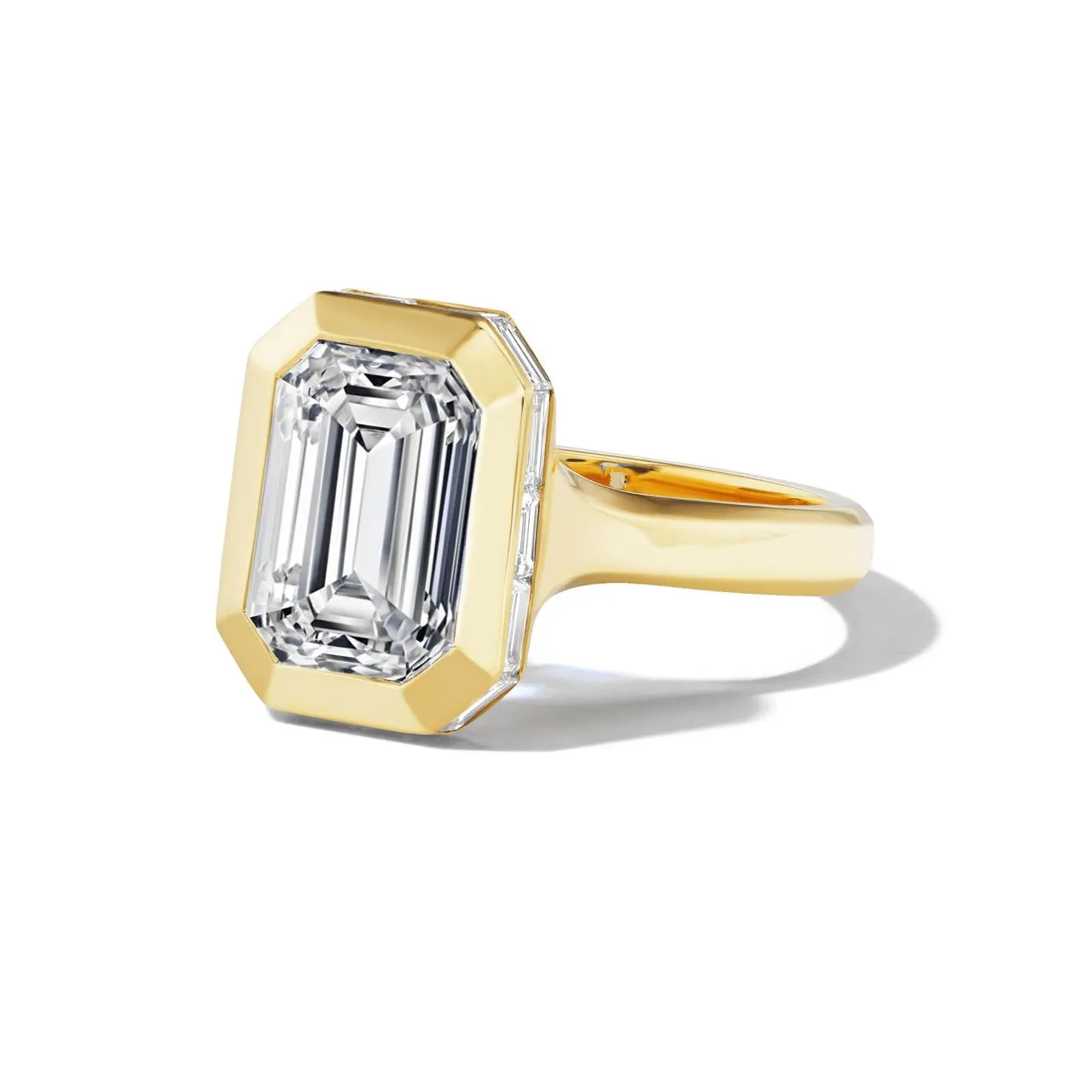 SHIELD BEZEL SET EMERALD CUT DIAMOND ENGAGEMENT RING