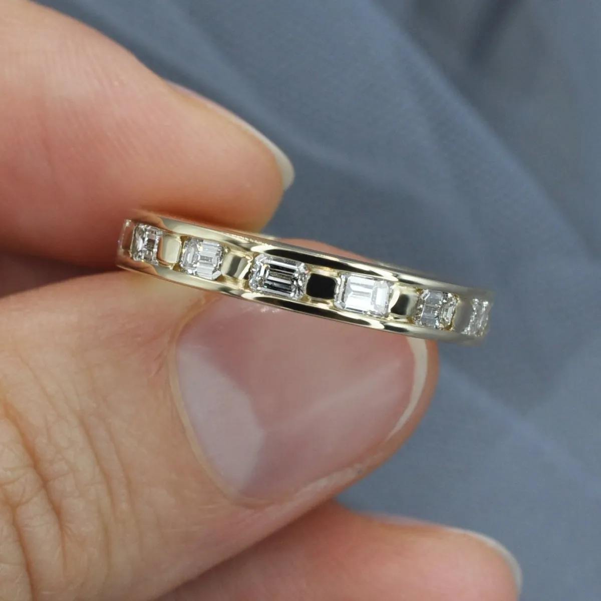 Stunning 2.50 CT Emerald Cut Diamond Eternity Ring in 14KT Yellow Gold